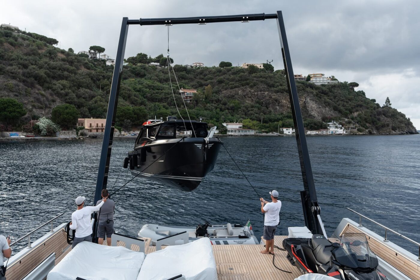 Our innovative, powerful A-frame, a hydraulic crane system, redefines yachting possibilities by
                                    effortlessly launching and retrieving tender and other toys. This technology, commonly employed
                                    in research vessels, marks a pioneering introduction into the yachting industry, specifically within
                                    our size segment.

   When not in use, the A-frame seamlessly disappears into the deck, preserving the pristine
                                    appearance of the main deck's teak surface. This clever design ensures that no part of your deck
                                    view is obstructed by the crane, enabling you to maximize the available space for toy storage or
                                    creating a luxurious beach club experience.